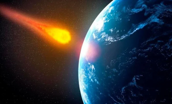 Foto ilustracion de un asteroide acercandose a la Tierra